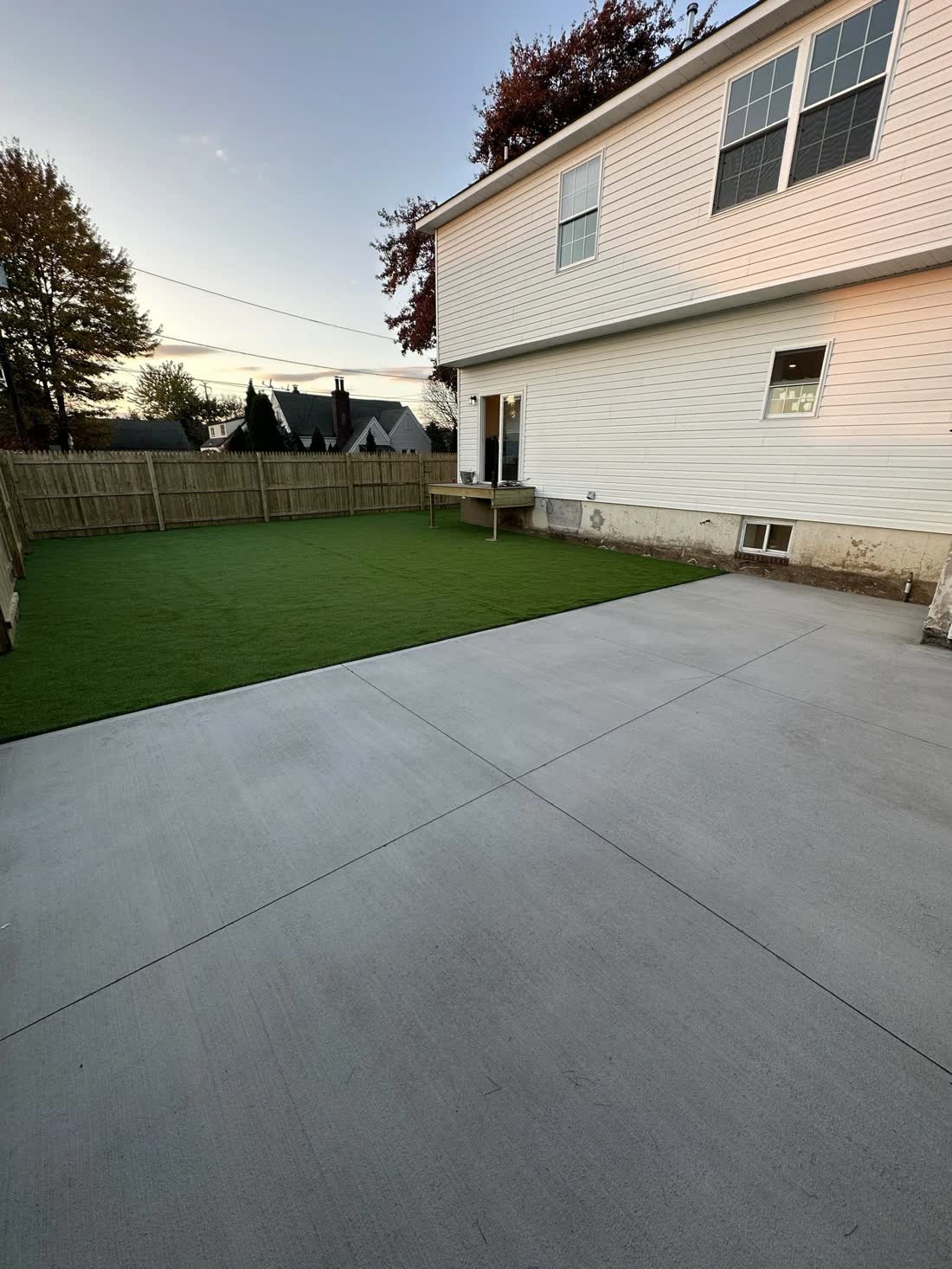 New concrete driveway at dusk